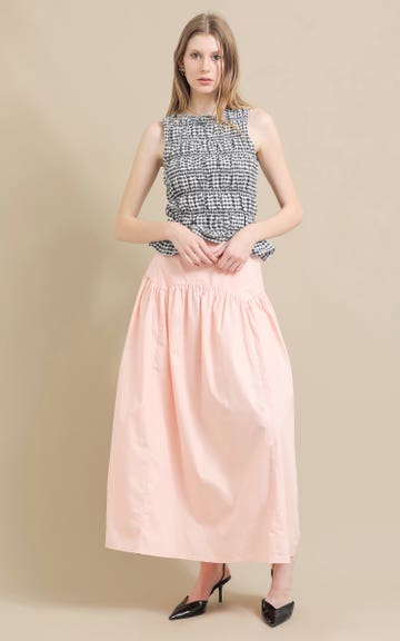 Shop our Curved Yoke Drop Waist Skirt in Blush
